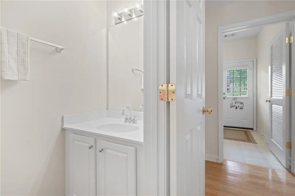 Bathroom with vanity and wood finished floors