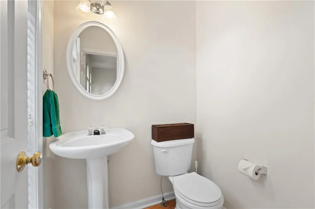 Bathroom featuring toilet and baseboards