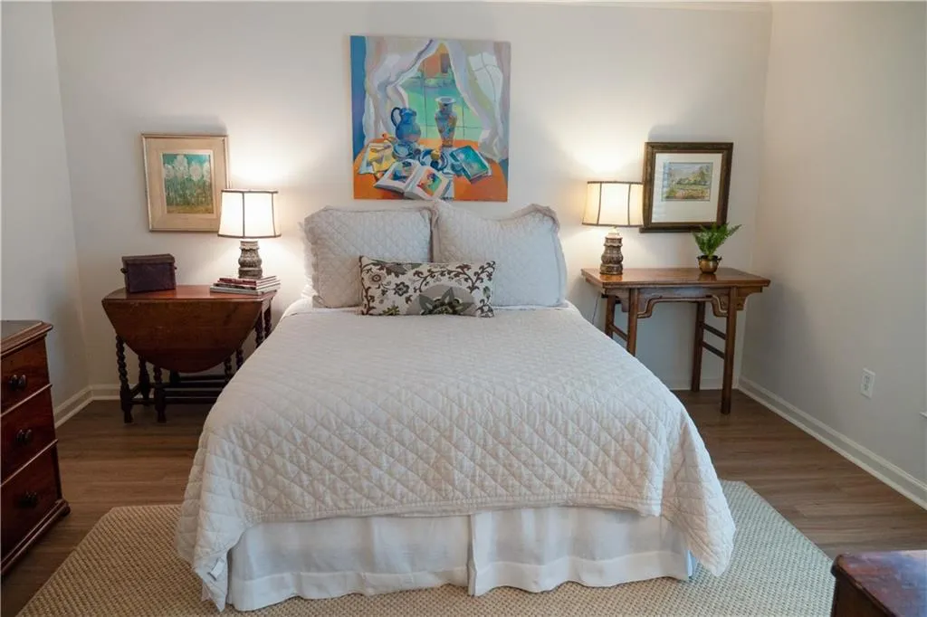 Bedroom #1 - LVT wood flooring, ceiling fan and TONS of Natural light