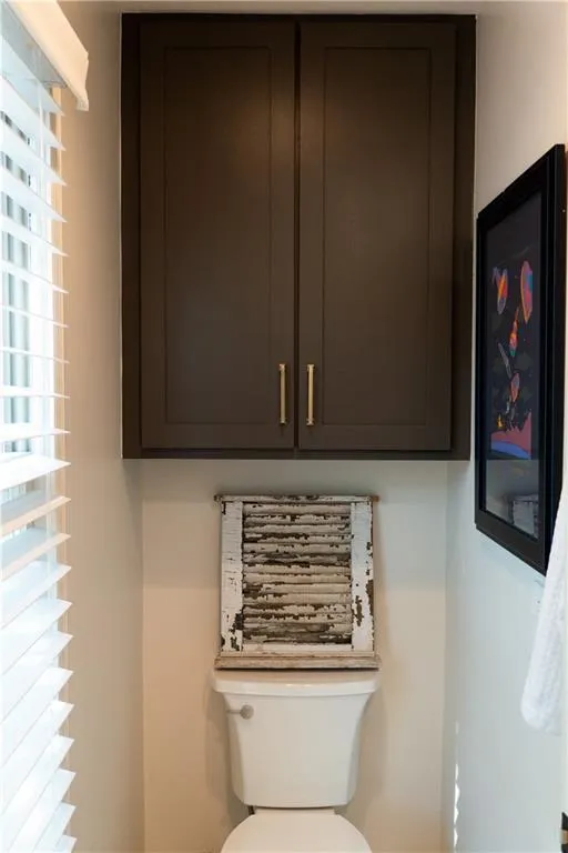 Bathroom with toilet and plenty of natural light