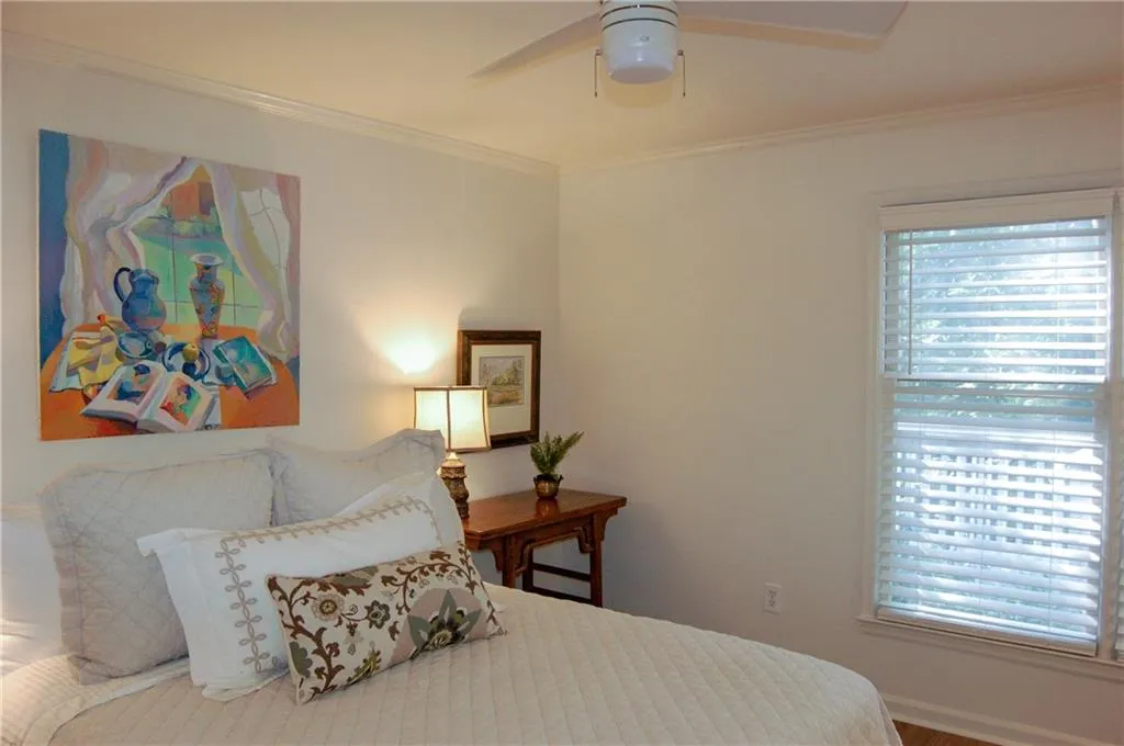 Bedroom featuring ceiling fan and crown molding - TONS OF NATURAL LIGHT