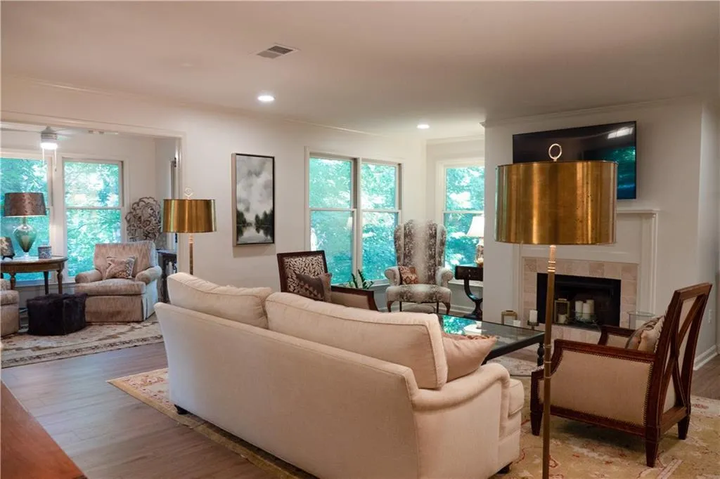 Fireside Living room with hardwood / wood-style flooring, and ornamental molding.  Look at your view!