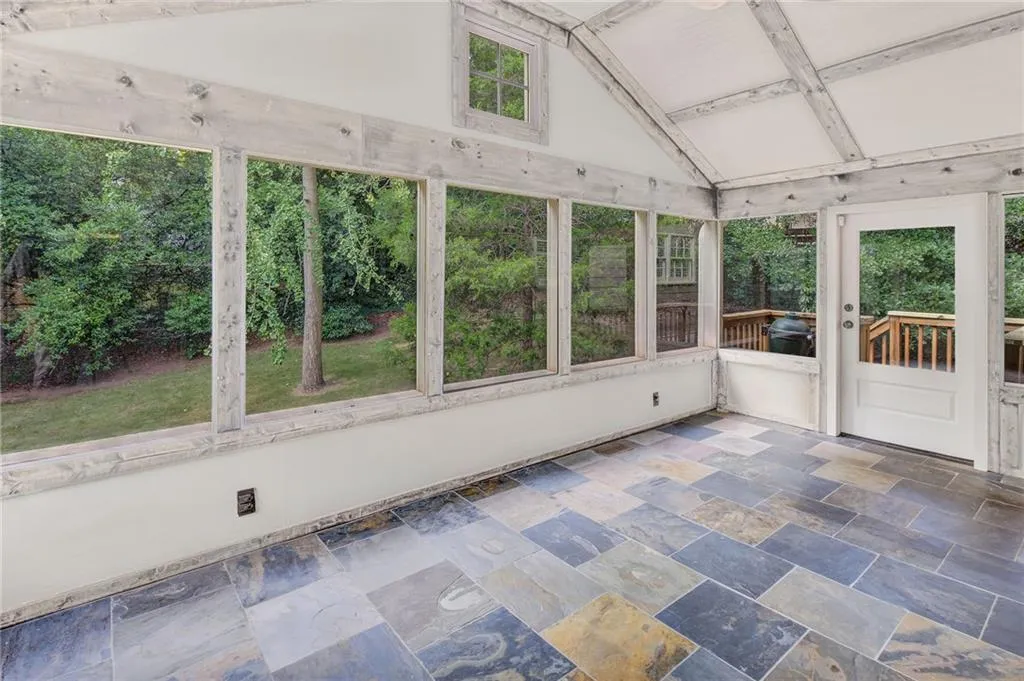 Screened porch with outdoor fireplace