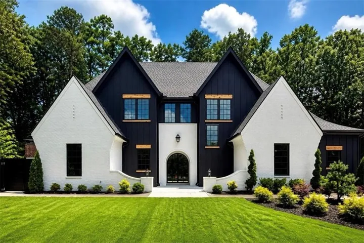 Contemporary facade with white brick and vertical black siding