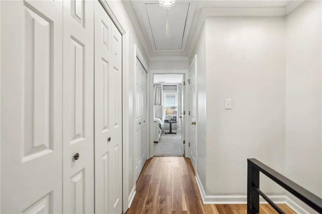 Upstairs landing and hall provide ample closet storage.