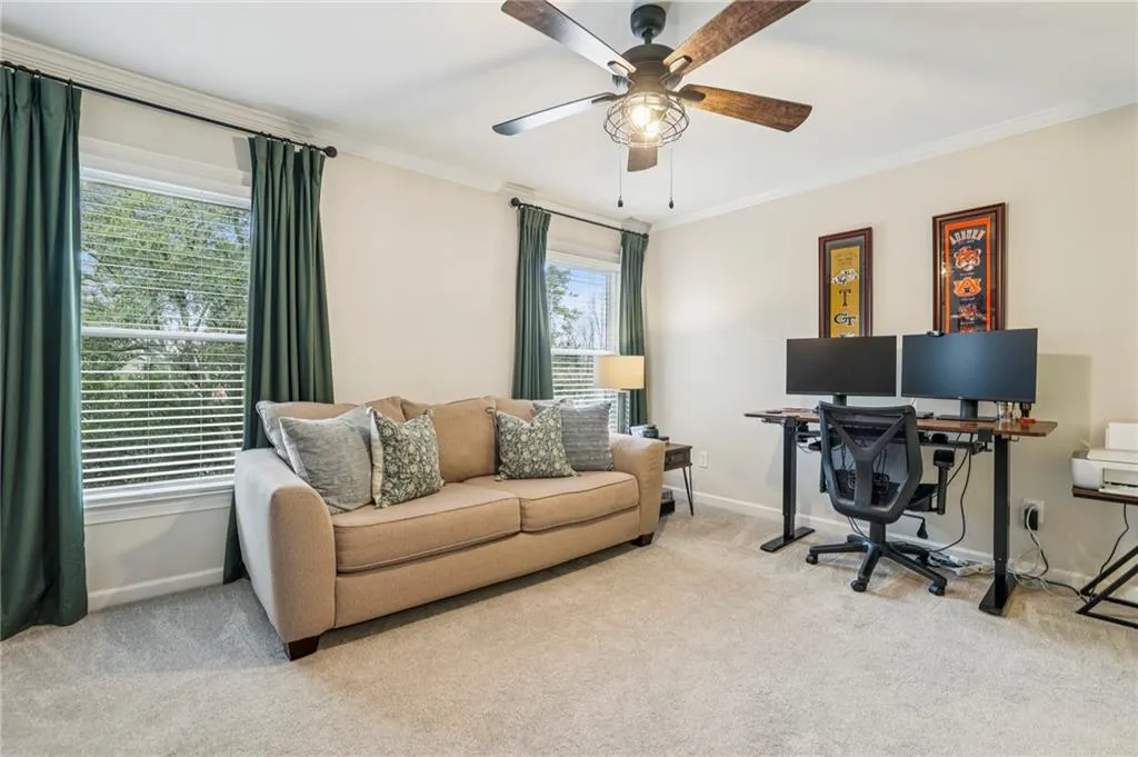 Spacious secondary bedroom with abundant natural light and generous closet space.