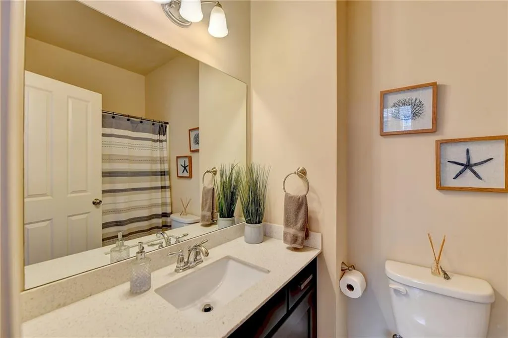 Bathroom with toilet and large vanity