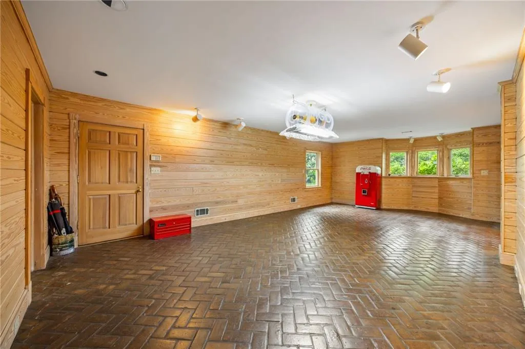Terrace level rec room or gym. Ready for a pool table, ping pong, gaming equipment or a HUGE TV to watch the game There is a big bar and full bath.