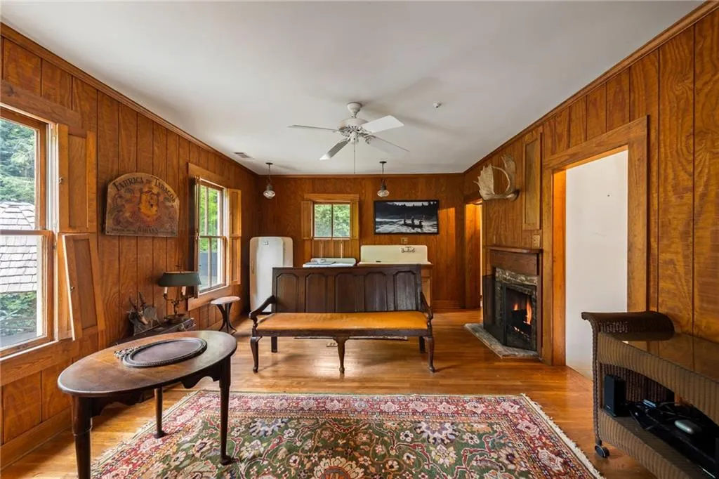 Living room and kitchen of the carriage house exudes charm