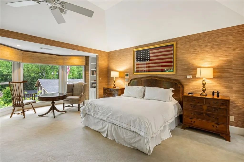 Love the view of the cabin and tennis court from your bed. Forgot to close the blinds-just push a button