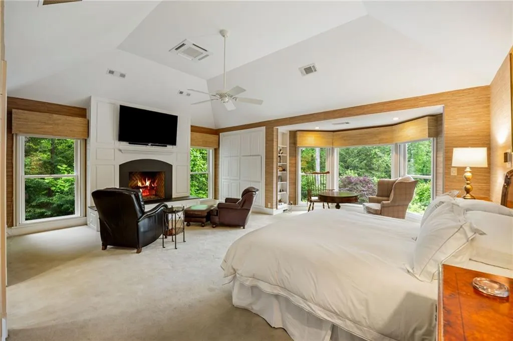 KING SIZE primary bedroom with spectacular views, fireplace and convenient electric blinds