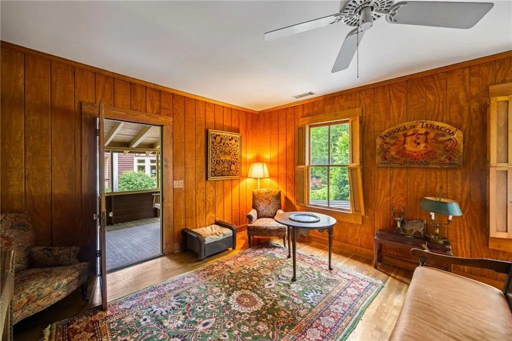 Living room opens to full length screened porch. Bet it was a sleeping porch at one time.