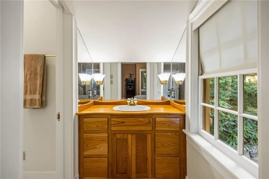 Real wood cabinetry in jack and jill baths