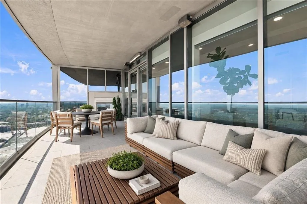 Open air balcony with fireplace off kitchen & family room