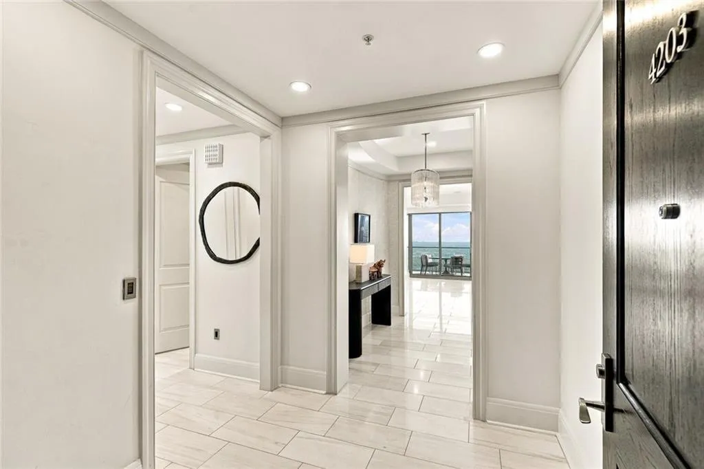 Remodeled entry foyer with polished porcelain floor