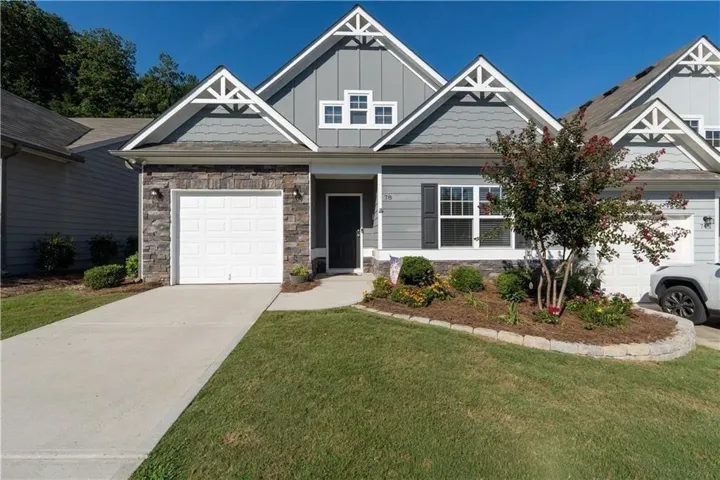 Stone and siding exterior with decorative gables