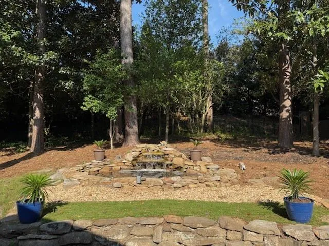 Backyard with water feature and waterfall