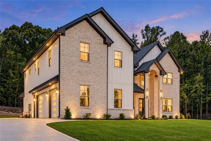 Stone and vertical siding exterior with gabled roof lines
