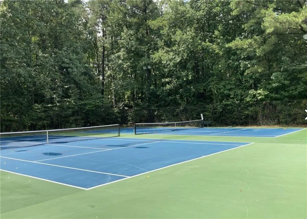 View of tennis court with community basketball court View of tennis court with community basketball court