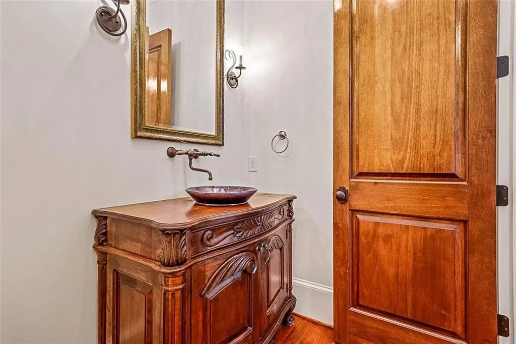 Bathroom with hardwood / wood-style floors and vanity