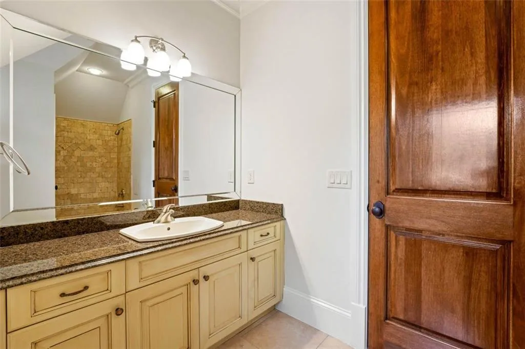 Bathroom with tile flooring and vanity