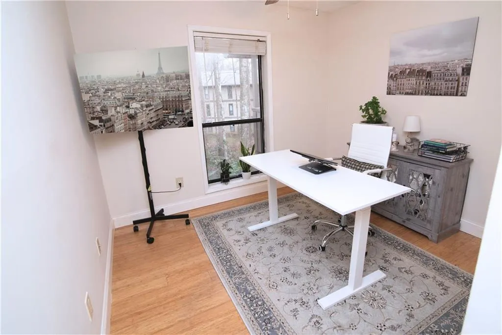 Office space with light wood-style floors and baseboards