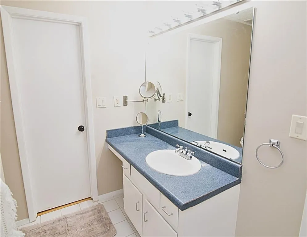Bathroom featuring vanity and light tile patterned flooring