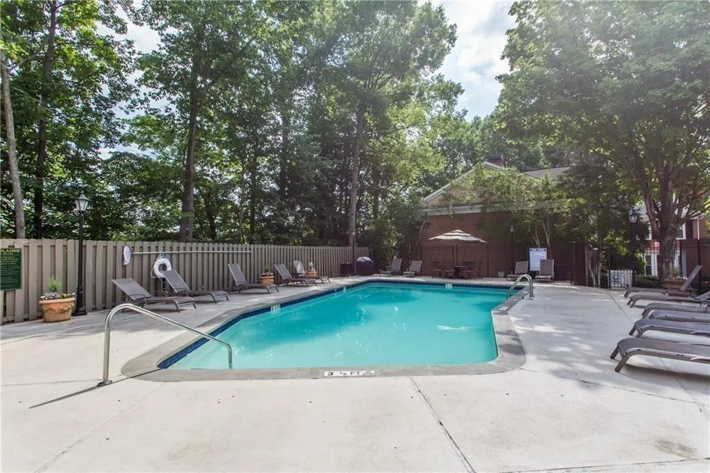 Community pool with a patio area