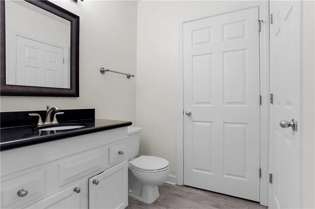 Bathroom with vanity and light wood-type flooring