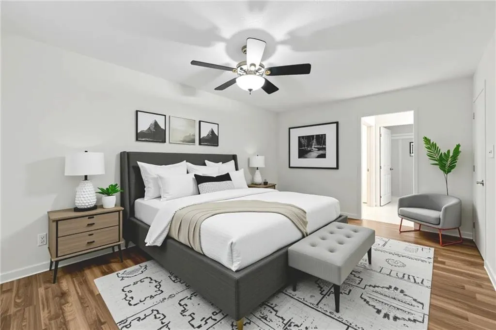 Bedroom with wood finished floors and a ceiling fan