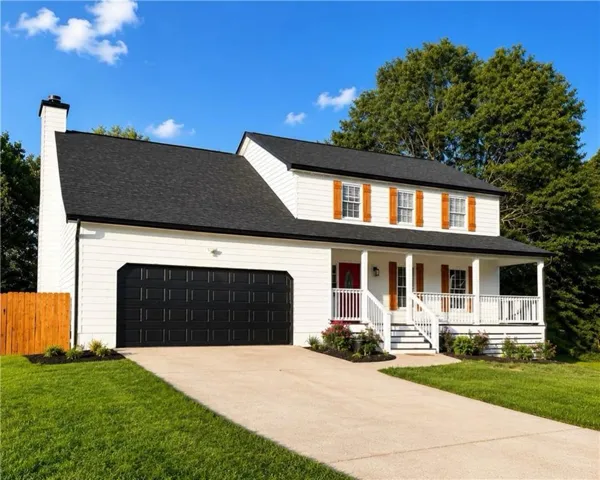 White siding exterior with a black asphalt shingle roof