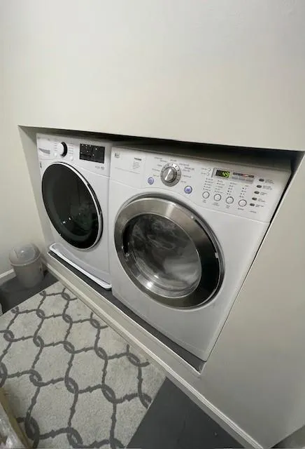 Upstairs Laundry 
 Room in Bonus room Clothes washing area featuring baseboards, laundry area, and washer and dryer Stay with the house