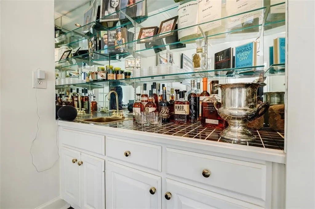 Bar featuring wet bar and a sink
