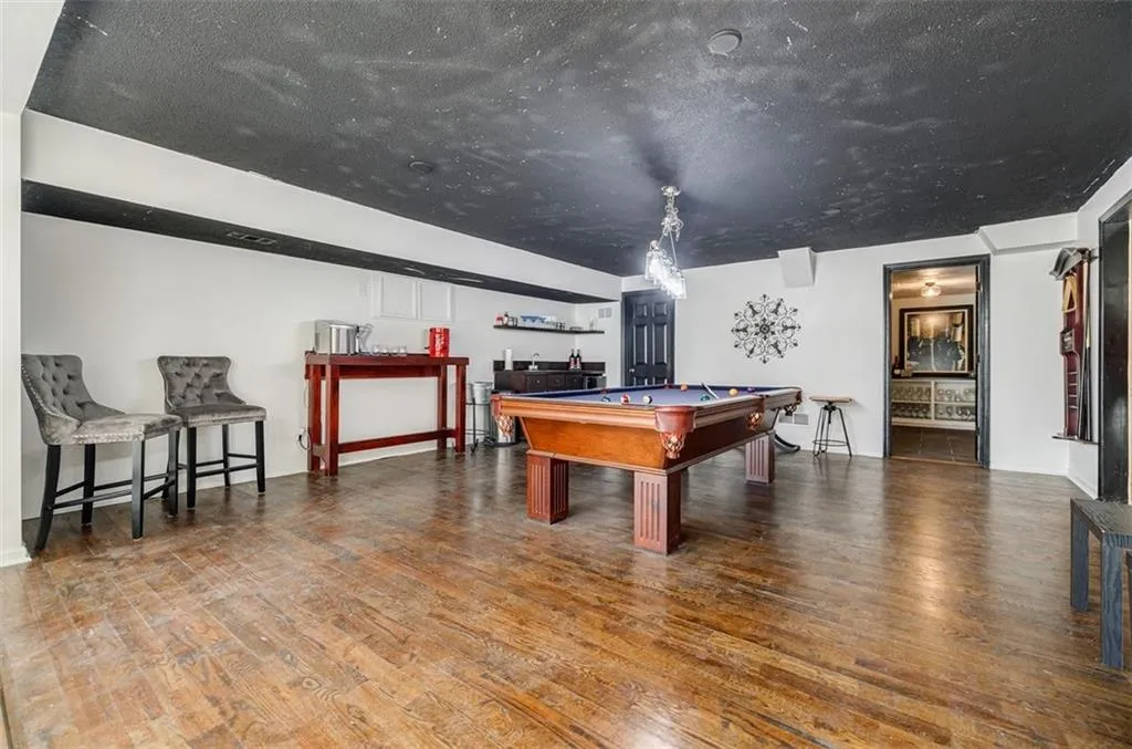 Game room featuring billiards and wood finished floors