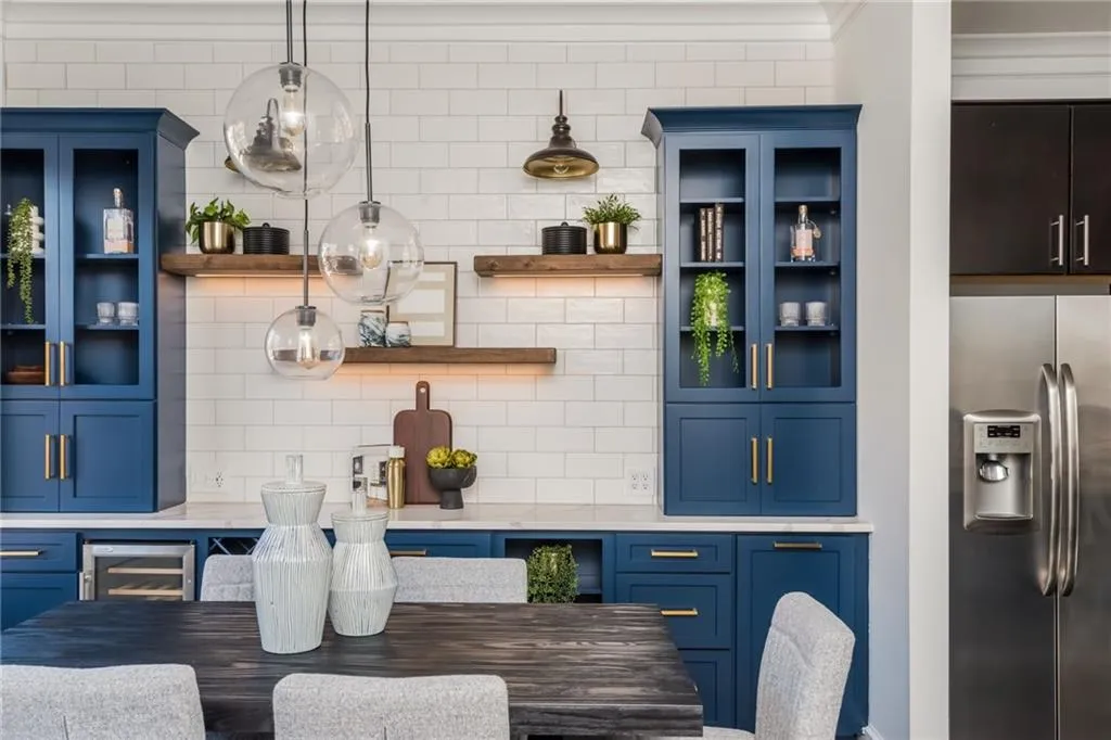 Large dining room with custom built-in bar featuring wine rack and beverage cooler