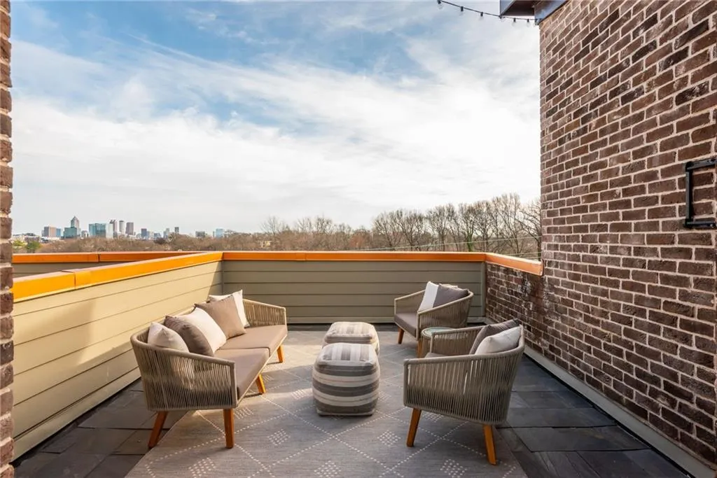 Private rooftop terrace with wet bar is perfect for entertaining guests or enjoying the sunsets and Atlanta skyline