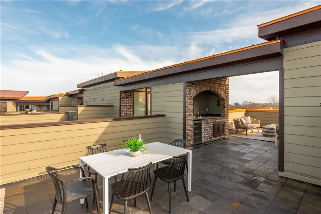 Private rooftop terrace with wet bar is perfect for entertaining guests or enjoying the sunsets and Atlanta skyline
