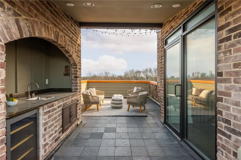 Private rooftop terrace with wet bar is perfect for entertaining guests or enjoying the sunsets and Atlanta skyline
