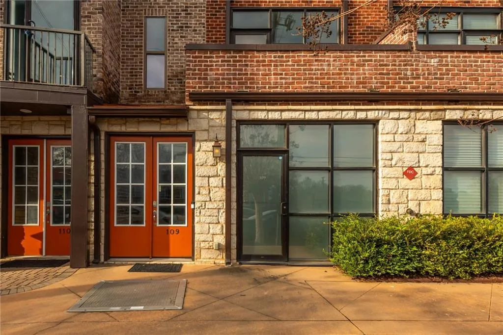 Modern, urban townhome with brick and stone facade