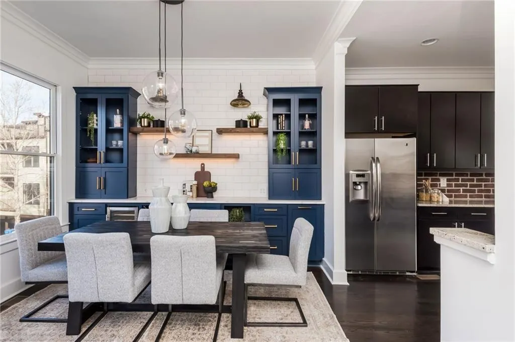 Large dining room with custom built-in bar featuring wine rack and beverage cooler