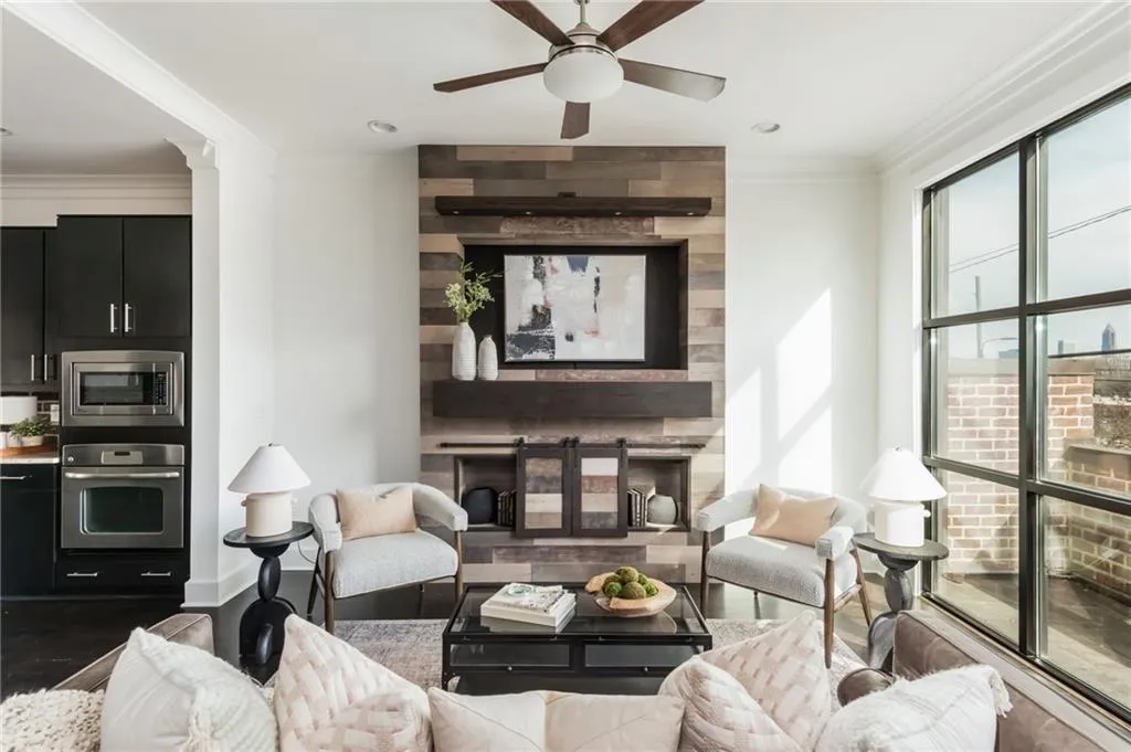 Open concept living room with floor to ceiling windows allows for beautiful natural light
