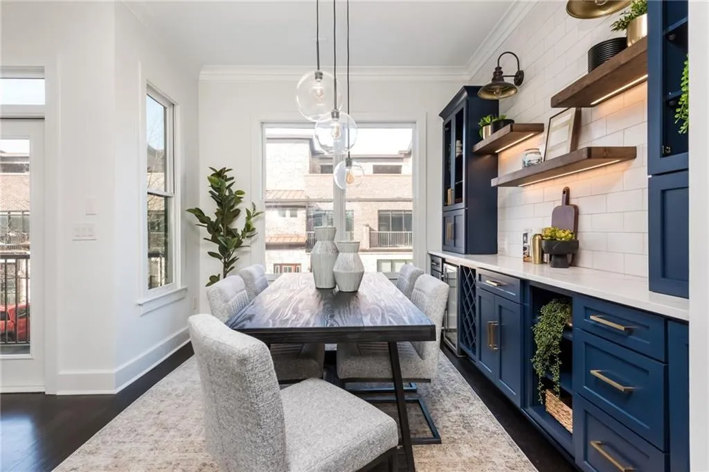 Large dining room with custom built-in bar featuring wine rack and beverage cooler