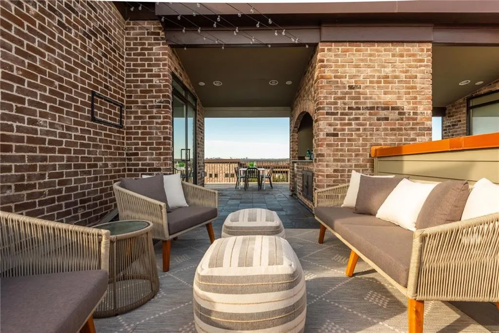 Private rooftop terrace with wet bar is perfect for entertaining guests or enjoying the sunsets and Atlanta skyline