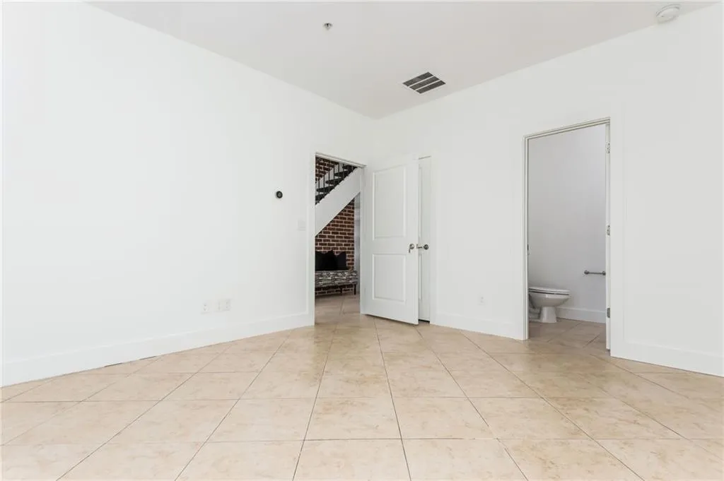 Lower level bonus room with separate commercial entrance provides the owner with the opportunity to run your business from home or makes for a great roommate plan, bonus room, home gym, etc.