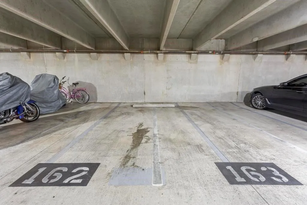 Two side by side dedicated covered parking spaces