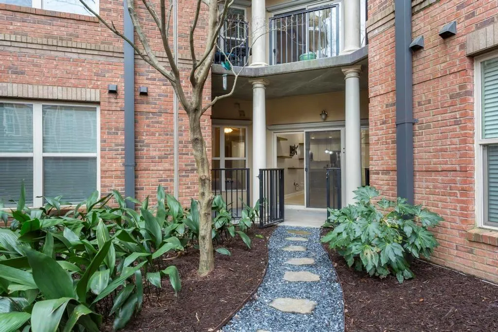 Unit private patio entrance with gate.