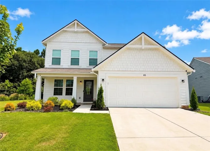 White two-story exterior with horizontal siding and shingle accents