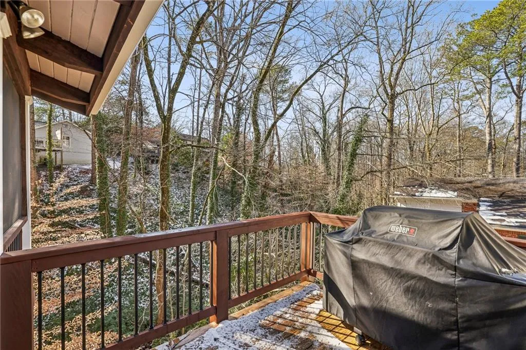 Screen porch has access to outdoor deck with a gas line installed for grilling. Grill remains with home.