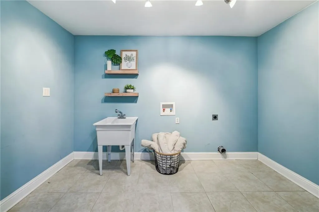 Darling laundry room with storage