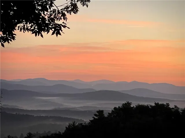 Expansive mountain scenery with layered peaks and valleys